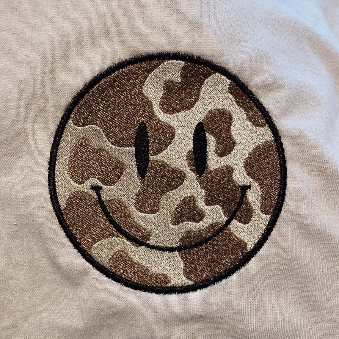 Cow Print Smiley Embroidered Tee