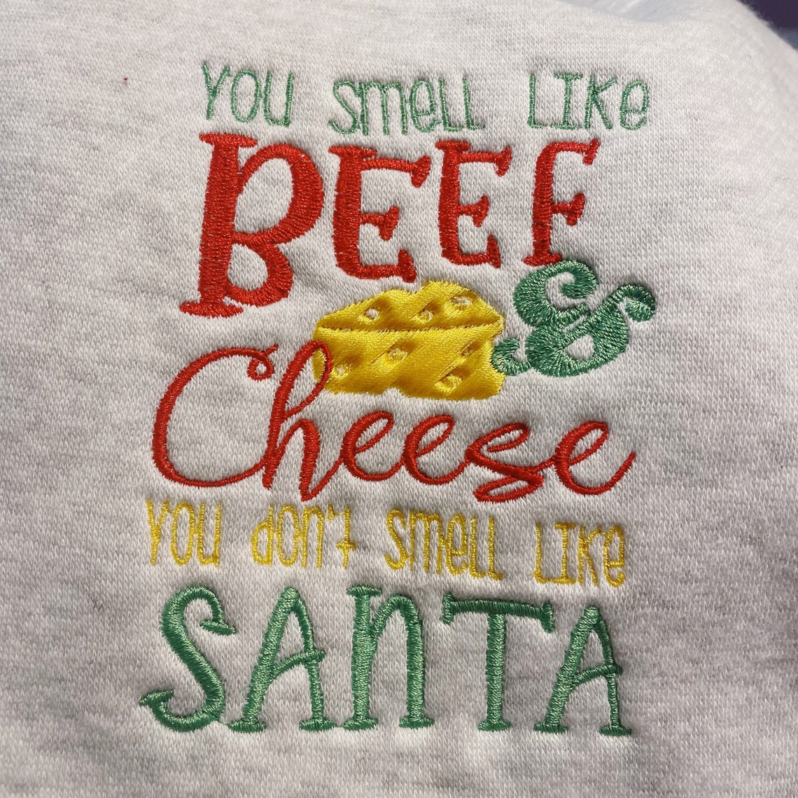 Inspired Buddy The Elf You Smell Like Beef And Cheese You Dont Smell Like Santa Embroidered Crewneck Sweatshirt